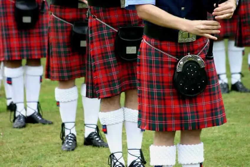 Bagpipers assembled for an outdoor parade